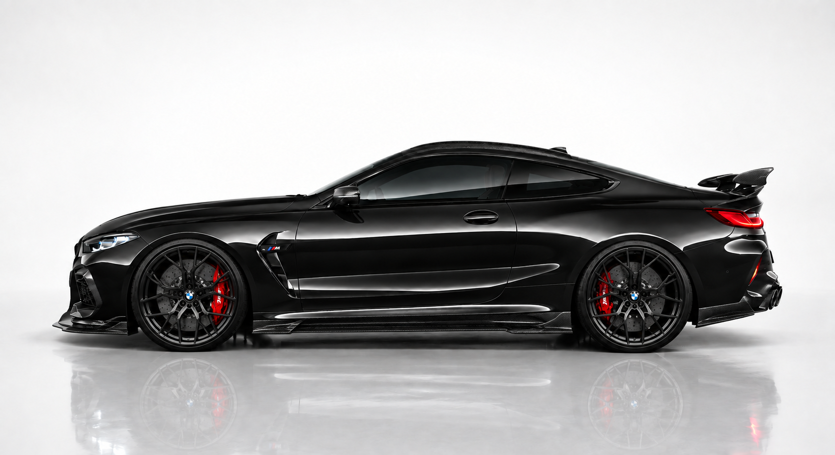 The same car after a full styling package: dark tinted glass, black alloy wheels, red calipers and carbon aero